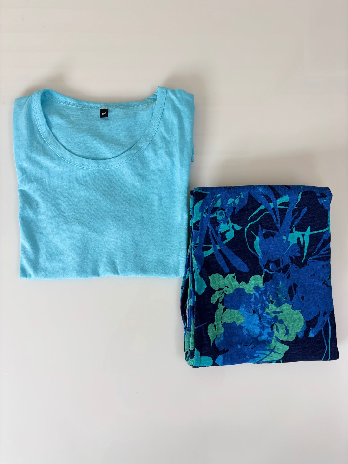 Aqua Blue Solid T-shirt with Navy Blue Floral Combo Pant Set