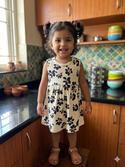 White Sleeveless Frocks with Black Flowers Design