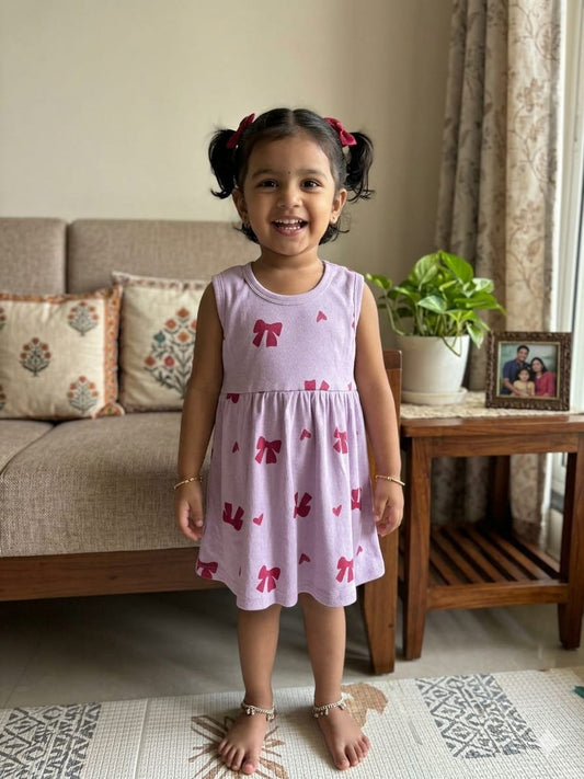 Lavender Sleeveless Frocks with Red Ribbon Design