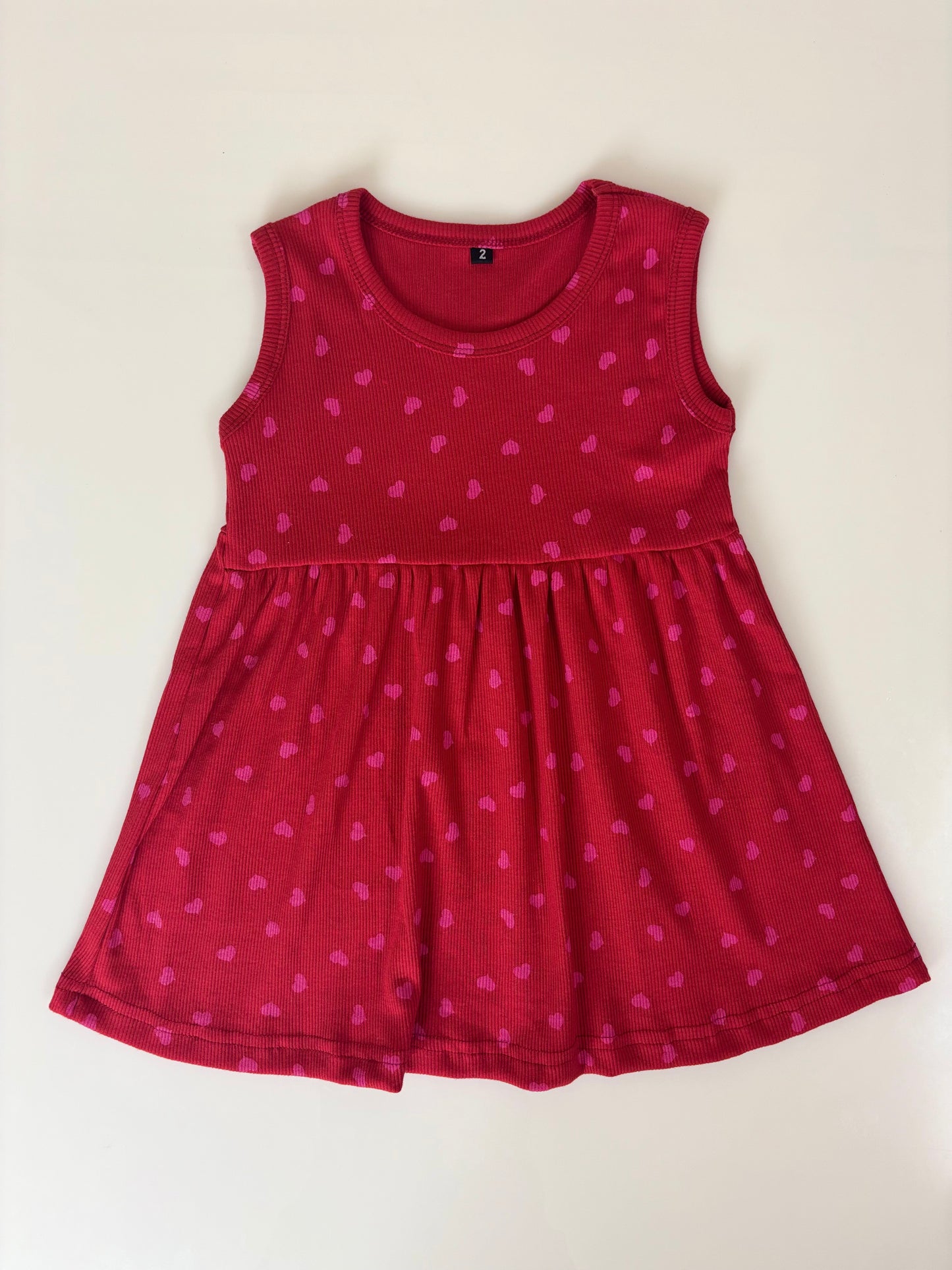 Red Sleeveless Frocks with Pink Heart Design