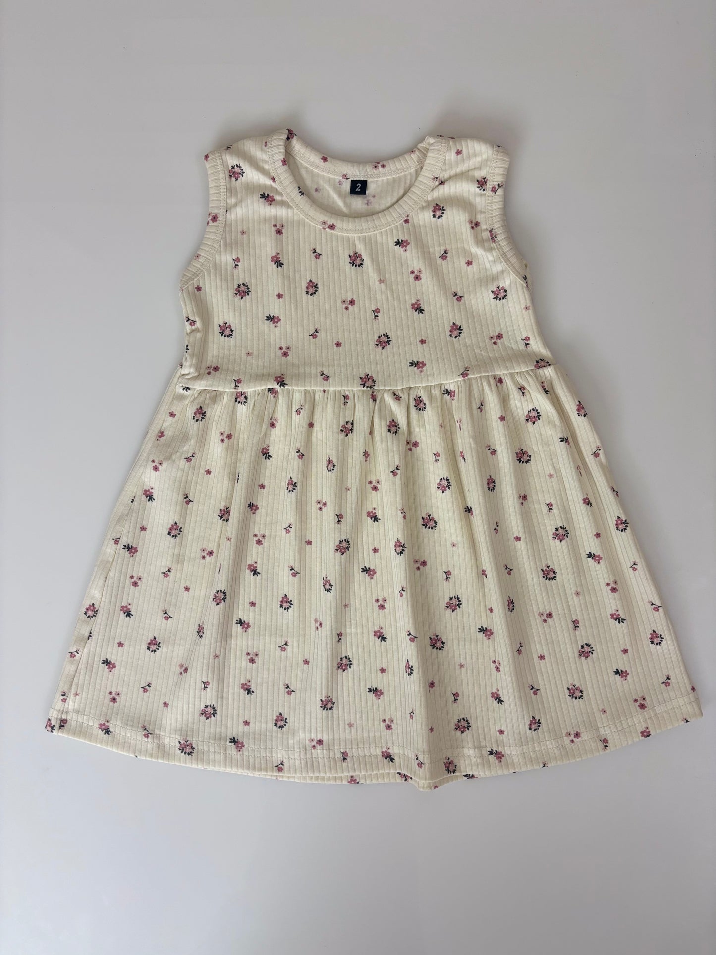 White Sleeveless Frocks with Pink flowers Design