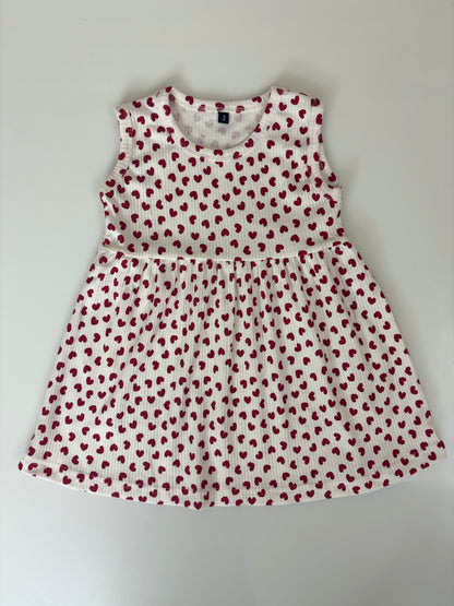 White Sleeveless Frocks with Red Heart Design